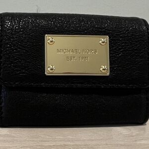 Michael Kors Black Leather Bi-fold Wallet With Goldtone Metal Accents